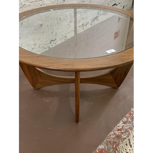 111 - A mid 20th century G Plan Astro teak and glass circular coffee table - approx. 46cm high x 83cm diam... 