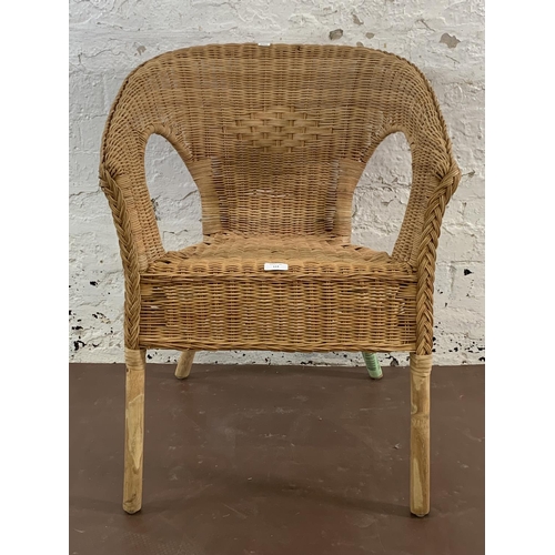 114 - A wicker armchair - approx. 77cm high x 58cm wide x 60cm deep