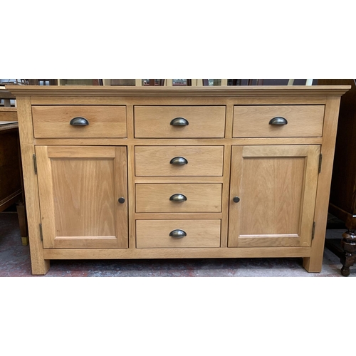 120 - A modern oak sideboard - approx. 85cm high x 140cm wide x 45cm deep