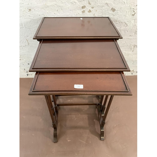 123 - A mahogany nest of three tables - largest approx. 70cm high x 56cm wide x 38cm deep