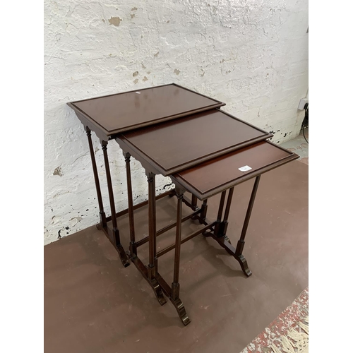 123 - A mahogany nest of three tables - largest approx. 70cm high x 56cm wide x 38cm deep