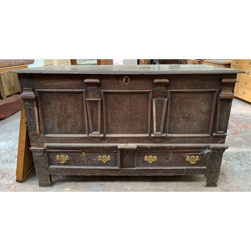 125 - An 18th century carved oak mule chest - approx. 81cm high x 133cm wide x 56cm deep