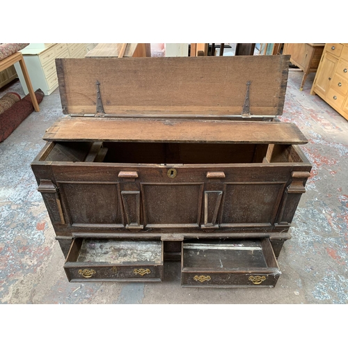 125 - An 18th century carved oak mule chest - approx. 81cm high x 133cm wide x 56cm deep