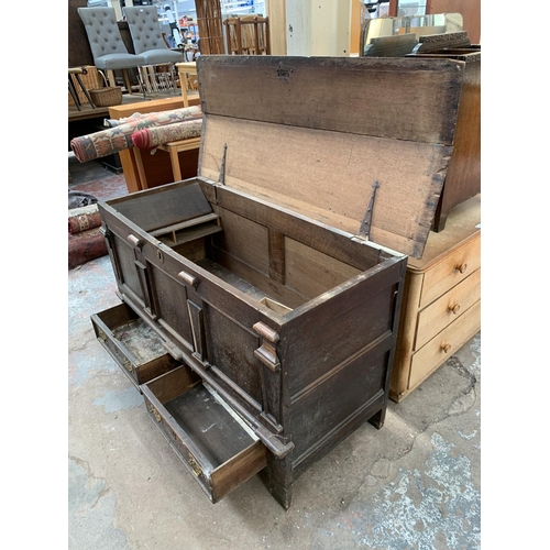 125 - An 18th century carved oak mule chest - approx. 81cm high x 133cm wide x 56cm deep