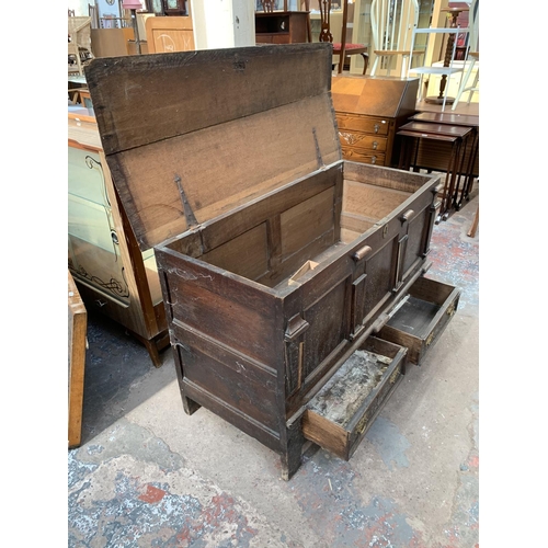 125 - An 18th century carved oak mule chest - approx. 81cm high x 133cm wide x 56cm deep