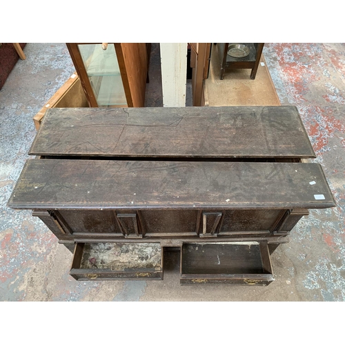 125 - An 18th century carved oak mule chest - approx. 81cm high x 133cm wide x 56cm deep