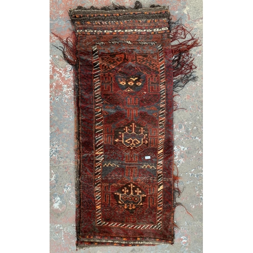 13 - A vintage Afghan Baluch cushion cover/rug - approx. 117cm x 49cm