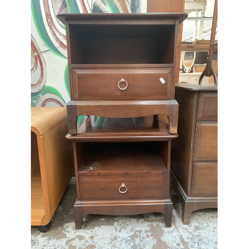 133 - A pair of Stag Minstrel mahogany bedside cabinets - approx. 50cm high x 53cm wide x 47cm deep