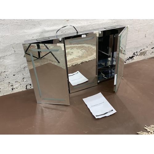 139 - A mirrored glass three door wall mountable cabinet with Bluetooth speakers and LED lights - approx. ... 