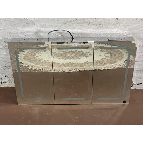 139 - A mirrored glass three door wall mountable cabinet with Bluetooth speakers and LED lights - approx. ... 