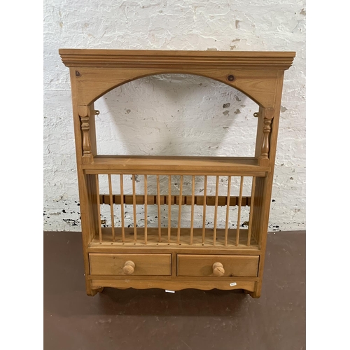 144 - A Victorian style pine wall mountable shelving unit with two lower drawers - approx. 104cm high x 75... 