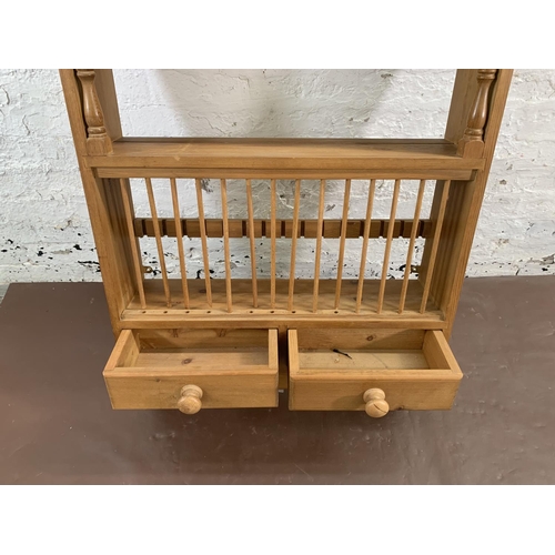 144 - A Victorian style pine wall mountable shelving unit with two lower drawers - approx. 104cm high x 75... 