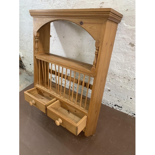 144 - A Victorian style pine wall mountable shelving unit with two lower drawers - approx. 104cm high x 75... 