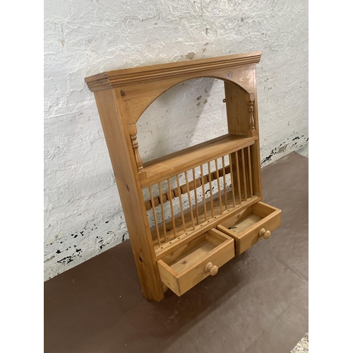 144 - A Victorian style pine wall mountable shelving unit with two lower drawers - approx. 104cm high x 75... 