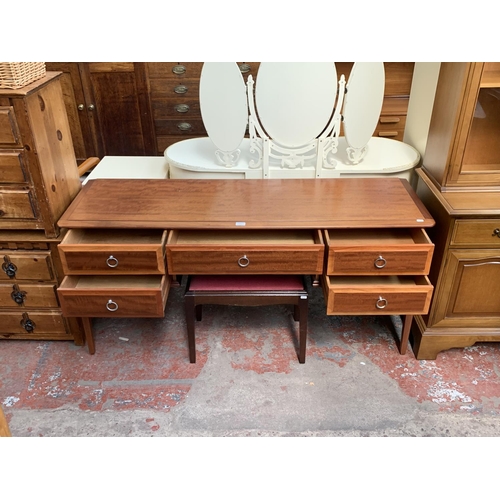 145A - A Stag Minstrel mahogany dressing table and stool - approx. 72cm high x 153cm wide x 46cm deep