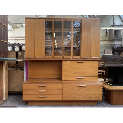 150 - A mid 20th century White & Newton Chichester teak wall unit - approx. 197cm high x 172cm wide x 51cm... 