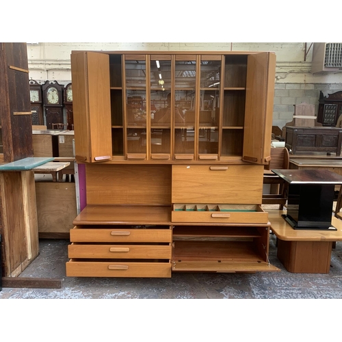 150 - A mid 20th century White & Newton Chichester teak wall unit - approx. 197cm high x 172cm wide x 51cm... 