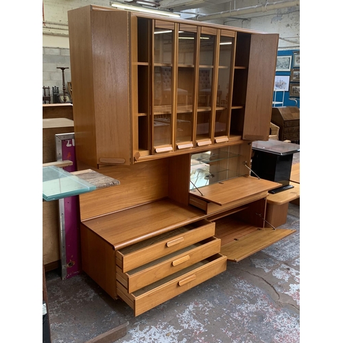 150 - A mid 20th century White & Newton Chichester teak wall unit - approx. 197cm high x 172cm wide x 51cm... 