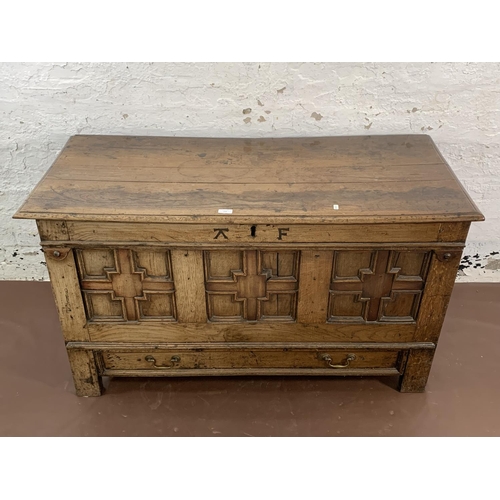 159 - A Georgian carved oak three panel mule chest - approx. 72cm high x 125cm wide x 55cm deep