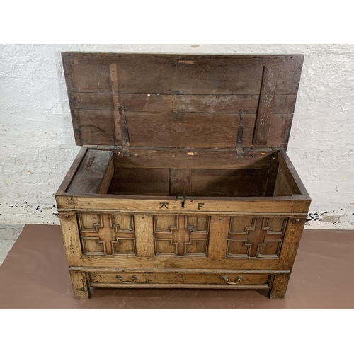 159 - A Georgian carved oak three panel mule chest - approx. 72cm high x 125cm wide x 55cm deep