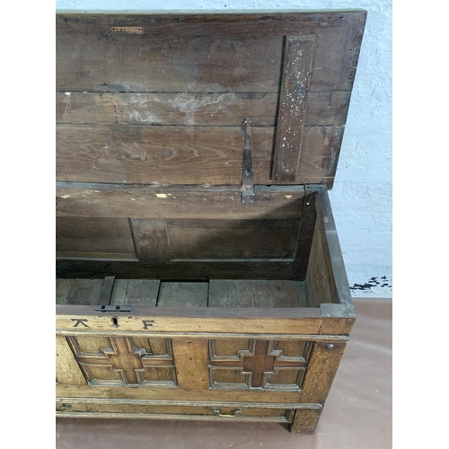 159 - A Georgian carved oak three panel mule chest - approx. 72cm high x 125cm wide x 55cm deep