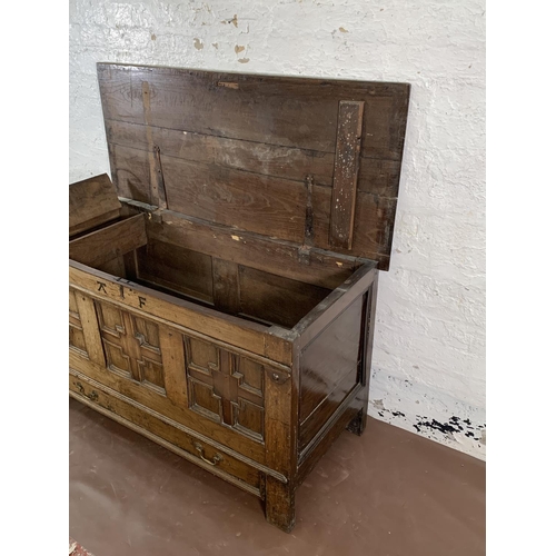 159 - A Georgian carved oak three panel mule chest - approx. 72cm high x 125cm wide x 55cm deep