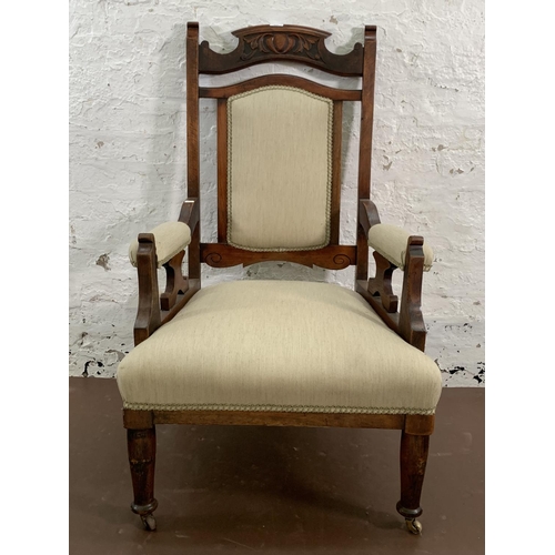 160 - An Art Nouveau carved mahogany and fabric upholstered armchair - approx. 110cm high x 65cm wide x 63... 