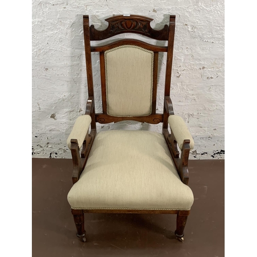 160 - An Art Nouveau carved mahogany and fabric upholstered armchair - approx. 110cm high x 65cm wide x 63... 