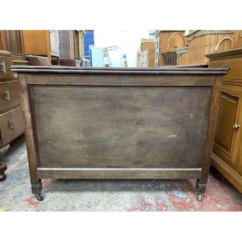 161D - A mid 20th century R. H. Whittle & Sons Ltd stained plywood blanket box on castors - approx. 69cm hi... 