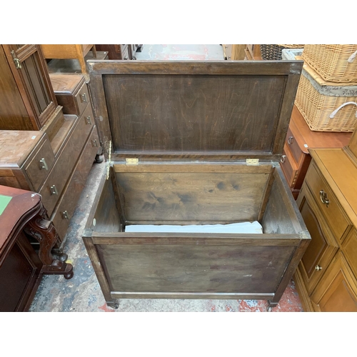 161D - A mid 20th century R. H. Whittle & Sons Ltd stained plywood blanket box on castors - approx. 69cm hi... 