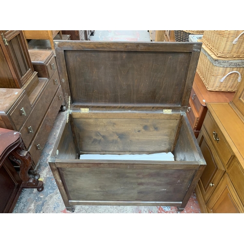 161D - A mid 20th century R. H. Whittle & Sons Ltd stained plywood blanket box on castors - approx. 69cm hi... 