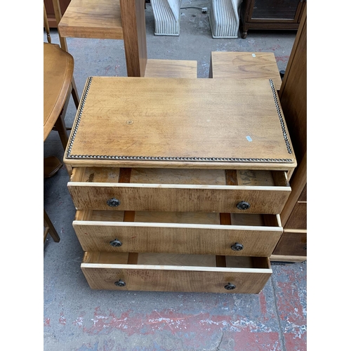 161H - An Art Deco style oak three piece bedroom suite with metal beaded decoration comprising two chests o... 