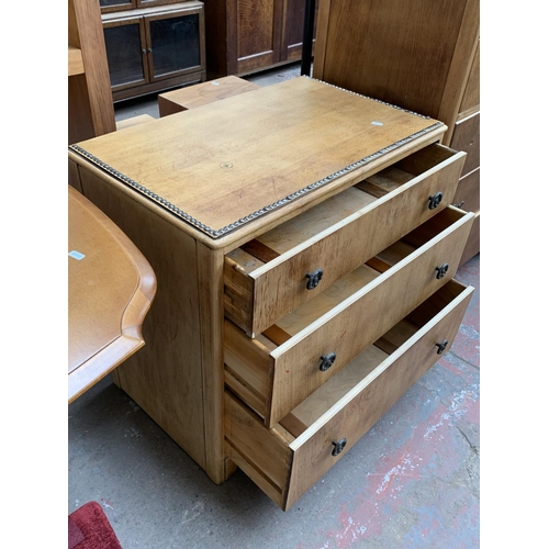 161H - An Art Deco style oak three piece bedroom suite with metal beaded decoration comprising two chests o... 