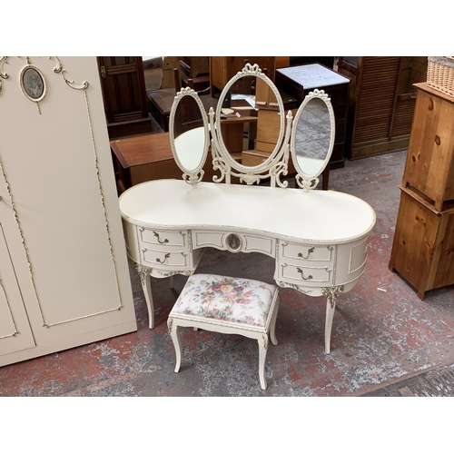 165 - A French Louis XV style white painted and gilded four piece bedroom suite comprising chest of drawer... 