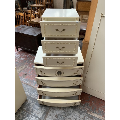 165 - A French Louis XV style white painted and gilded four piece bedroom suite comprising chest of drawer... 