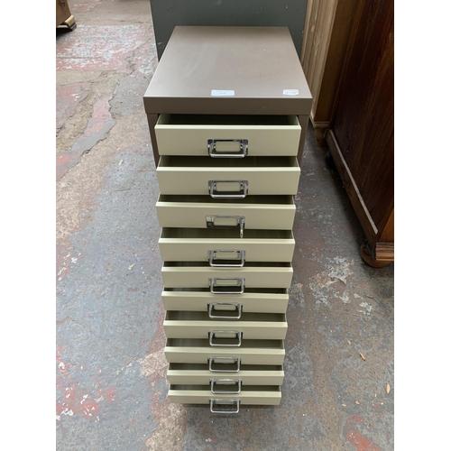 174 - A brown and cream metal ten drawer office filing cabinet - approx. 60cm high x 28cm wide x 41cm deep