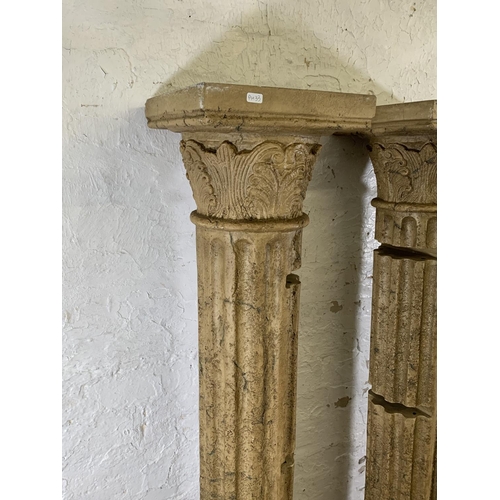 176 - A pair of fibreglass Corinthian column shelving units - approx. 180cm high x 30cm wide x 30cm deep