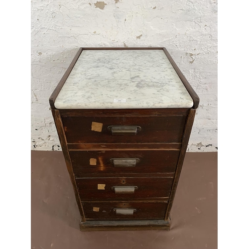 180 - An early 20th century stained pitch pine and marble top four drawer office filing cabinet - approx. ... 