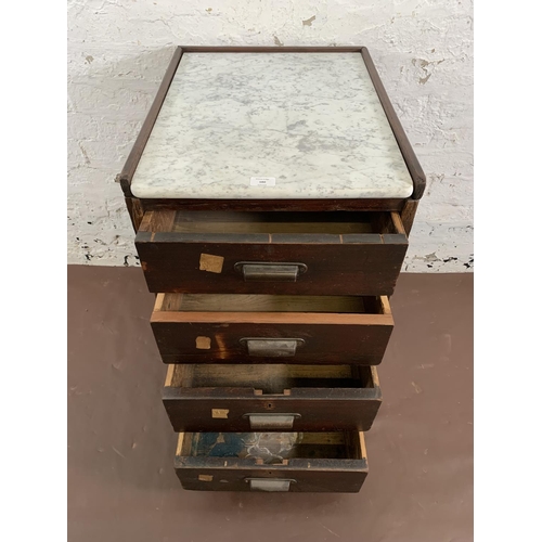 180 - An early 20th century stained pitch pine and marble top four drawer office filing cabinet - approx. ... 