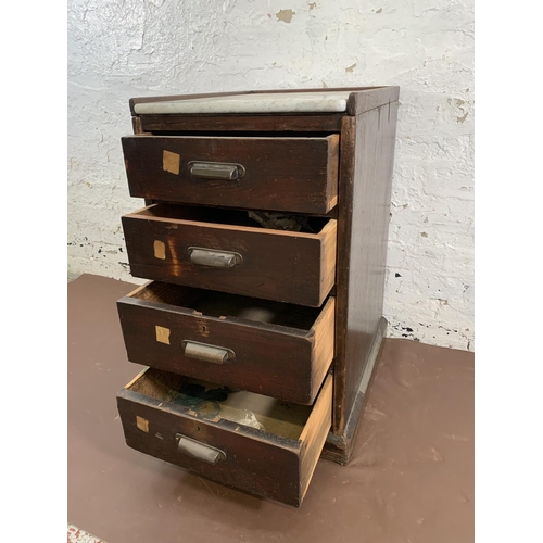 180 - An early 20th century stained pitch pine and marble top four drawer office filing cabinet - approx. ... 