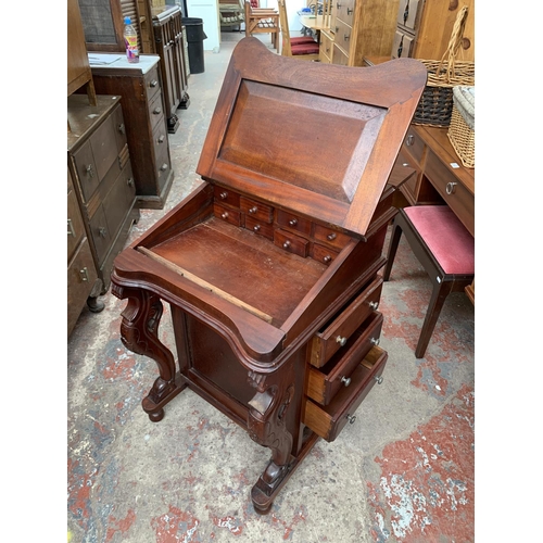 184 - A 19th century style mahogany Davenport desk with green leather writing surface and carved supports ... 