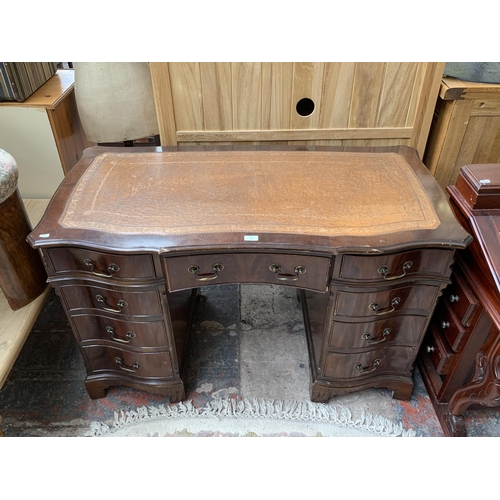 186 - A 19th century style mahogany serpentine twin pedestal writing desk with tan leather insert - approx... 