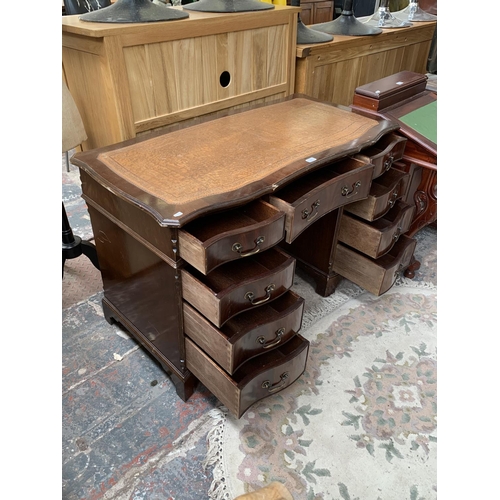 186 - A 19th century style mahogany serpentine twin pedestal writing desk with tan leather insert - approx... 