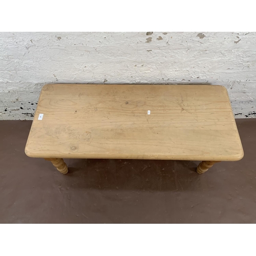188 - A solid pine rectangular coffee table - approx. 47cm high x 46cm wide x 107cm long