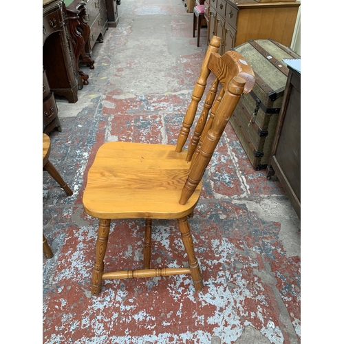 190 - Four pine spindle back farmhouse dining chairs