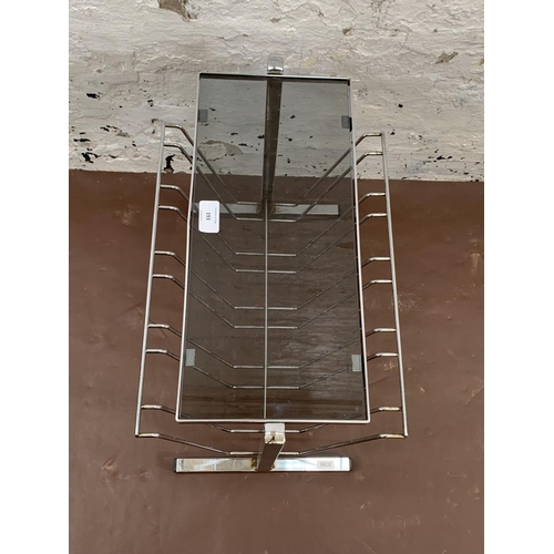 193 - A mid 20th century chrome and smoked glass magazine rack side table - approx. 39cm high x 30cm wide ... 