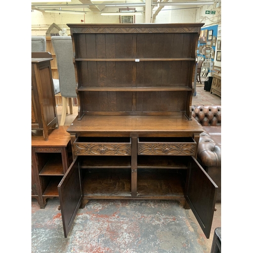 200 - A 17th century style carved oak welsh dresser - approx. 185cm high x 127cm wide x 50cm deep