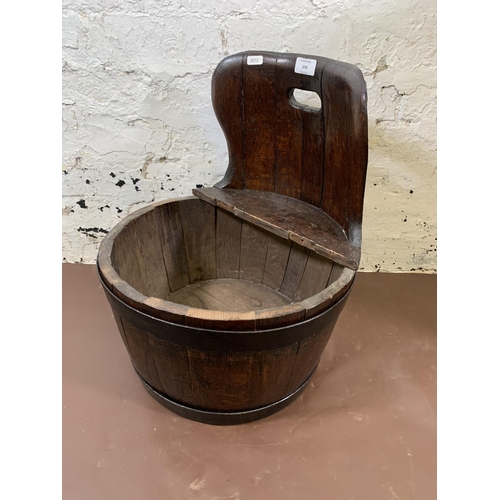 204 - A coopered oak and metal banded child's commode chair - approx. 48cm high x 40cm diameter