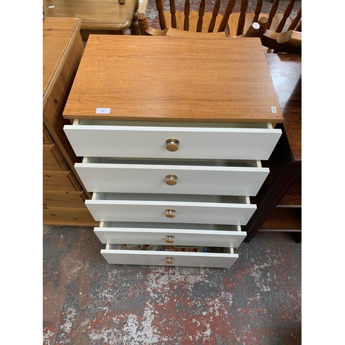 205 - A Schreiber teak effect and white laminate chest of drawers - approx. 87cm high x 60cm wide x 40cm d... 