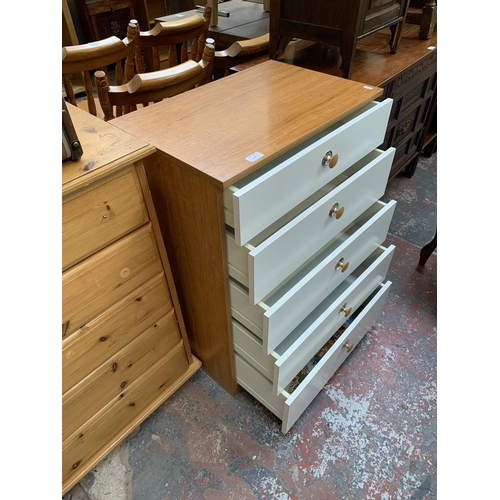 205 - A Schreiber teak effect and white laminate chest of drawers - approx. 87cm high x 60cm wide x 40cm d... 